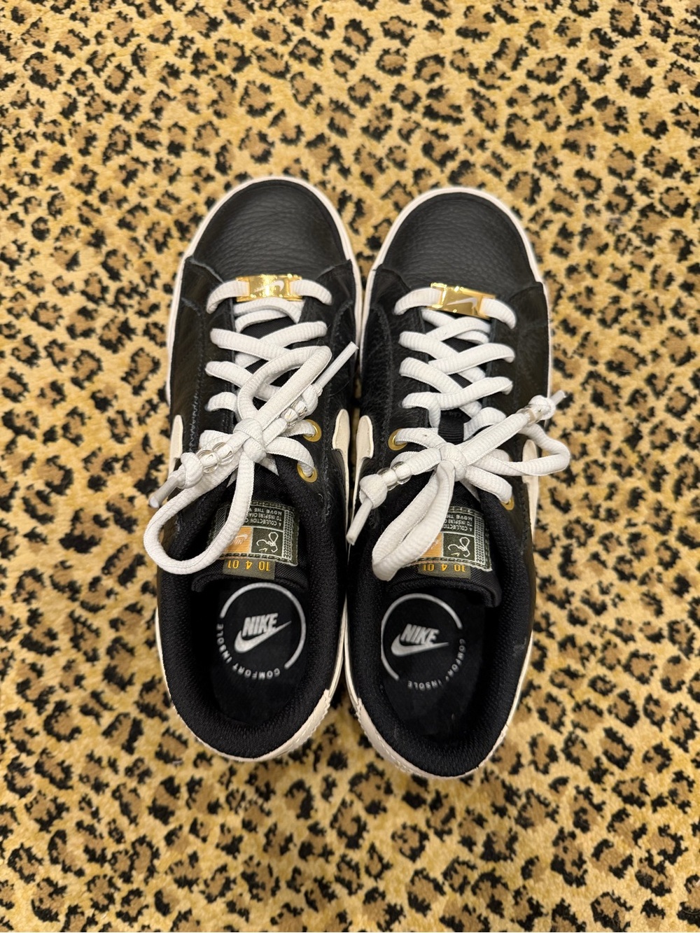 Nike Black and White Sneakers with Gold Details